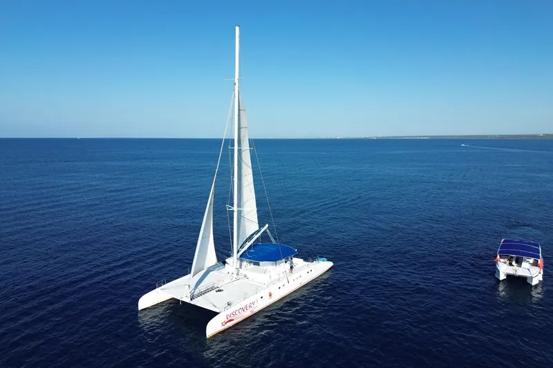 Catamaran sailing toward the island